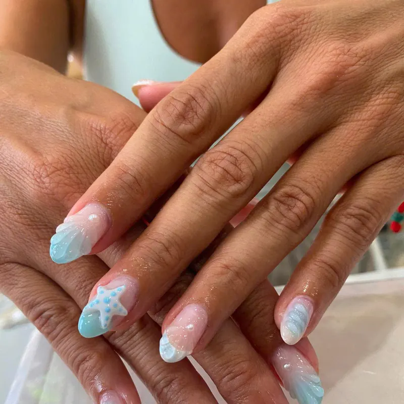 Turquoise nails with starfish beach art by LENA Nails & Beauty, nail salon in Da Nang