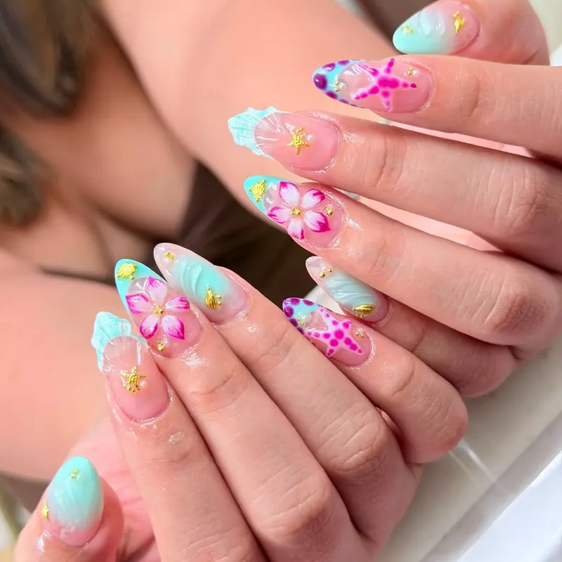 Almond nails with pink hibiscus and turquoise art by LENA Nails & Beauty, nail salon in Da Nang