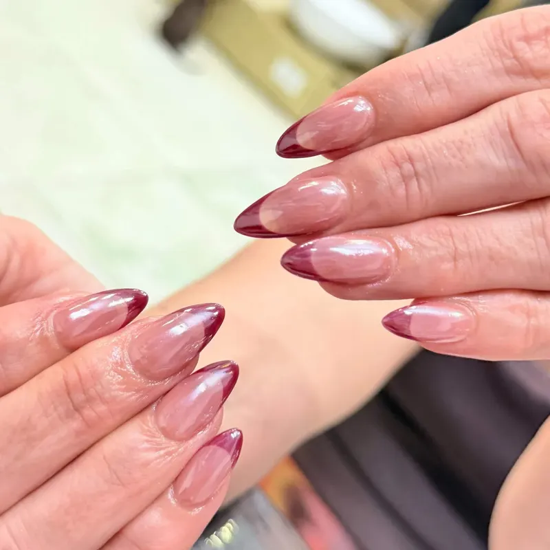 Almond nails with burgundy chrome French tips by LENA Nails & Beauty, nail salon in Da Nang