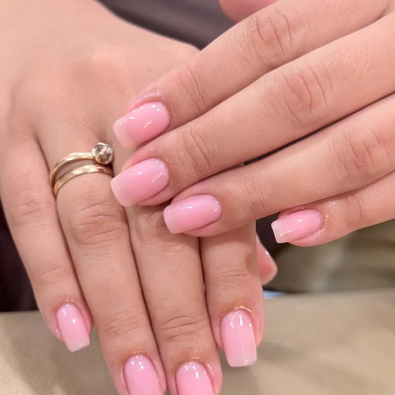 Glossy baby pink square nails by LENA Nails & Beauty, nail salon in Da Nang