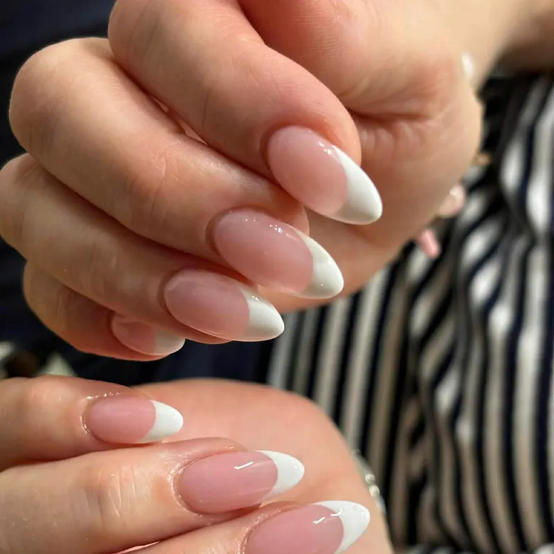 White French tip almond nails by LENA Nails & Beauty, nail salon in Da Nang