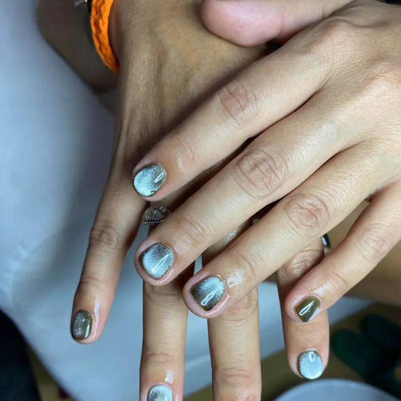 Teal nails with abalone shell art by LENA Nails & Beauty, nail salon in Da Nang