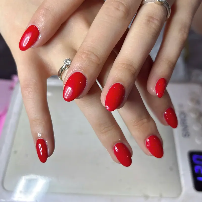 Classic red gel nails by LENA Nails & Beauty, nail salon in Da Nang