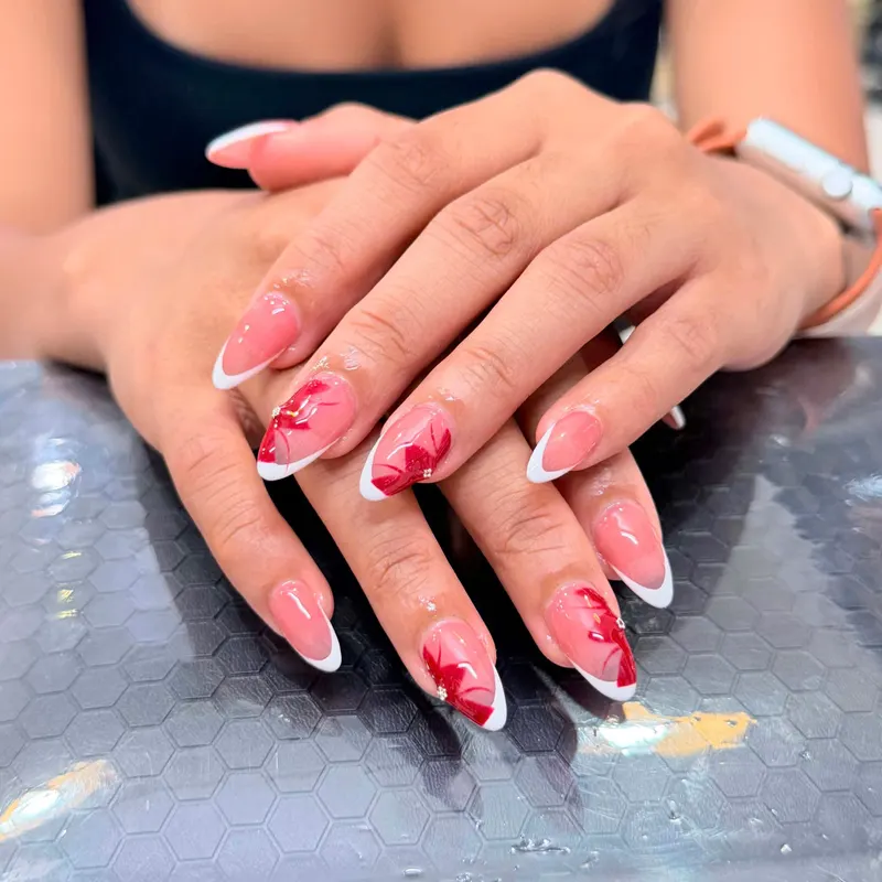 Red and white French almond nails by LENA Nails & Beauty, nail salon in Da Nang