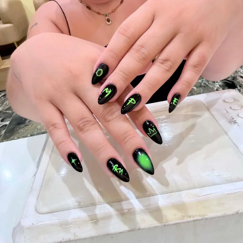 Black nails with neon art by LENA Nails & Beauty, nail salon in Da Nang