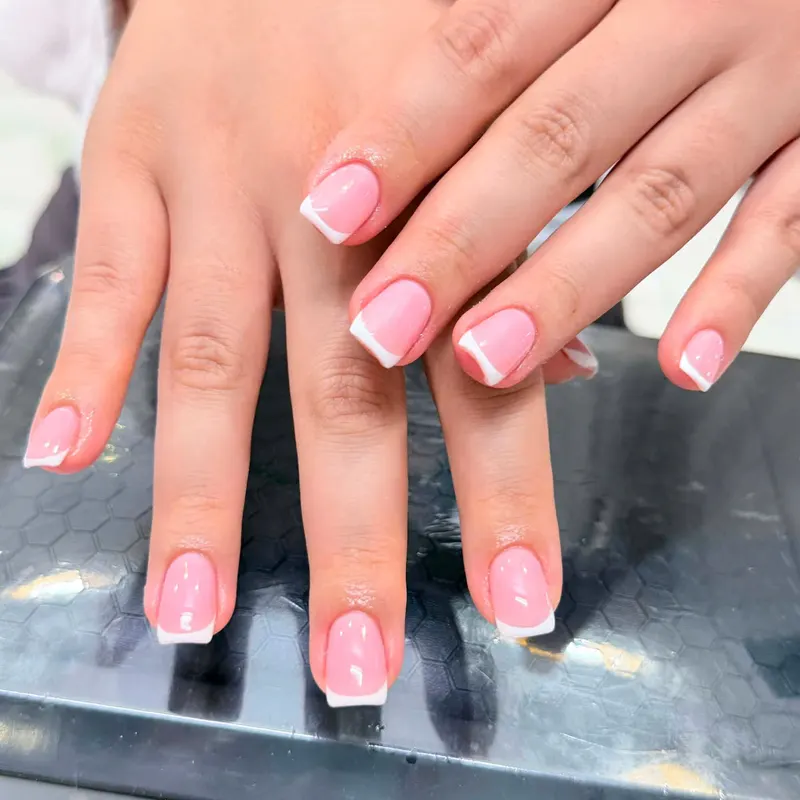 Pink and white French nails by LENA Nails & Beauty, nail salon in Da Nang