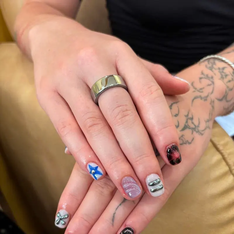 Short nails with playful mixed art by LENA Nails & Beauty, nail salon in Da Nang
