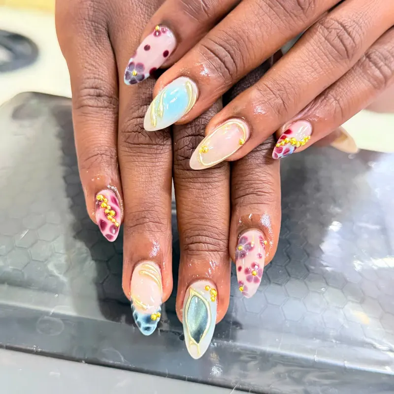 Colourful floral nail art with gold beads by LENA Nails & Beauty, nail salon in Da Nang