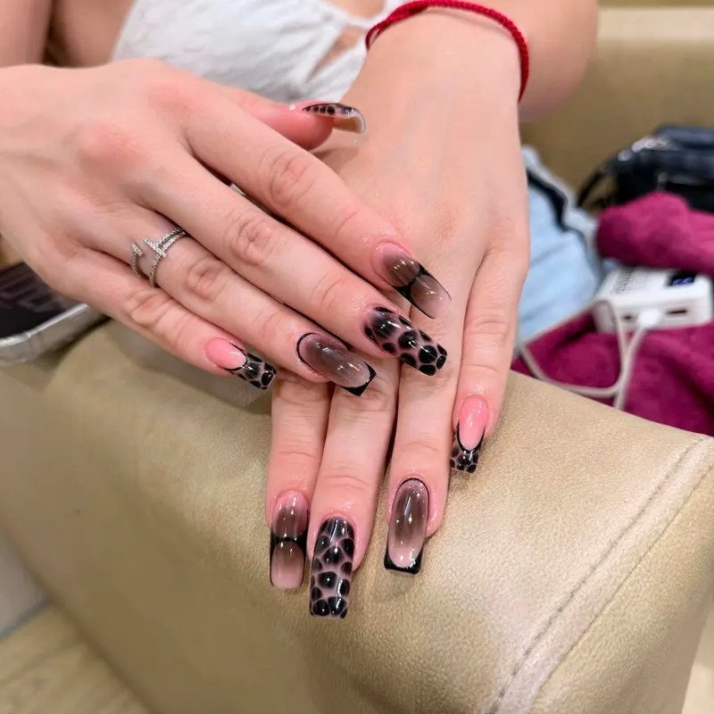 Black French coffin nails with leopard art by LENA Nails & Beauty, nail salon in Da Nang