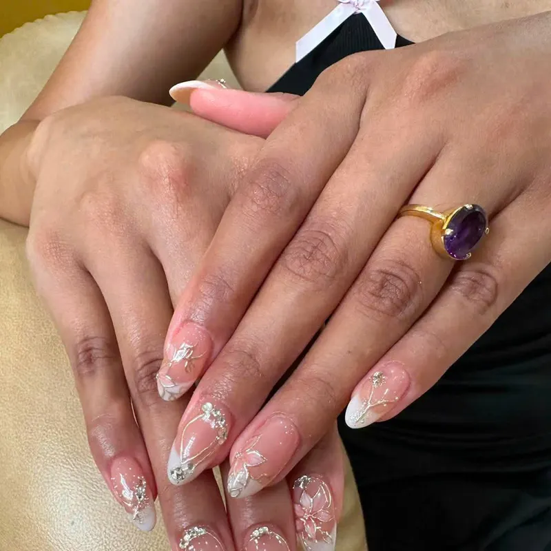 Bridal white French nails with rhinestones by LENA Nails & Beauty, nail salon in Da Nang