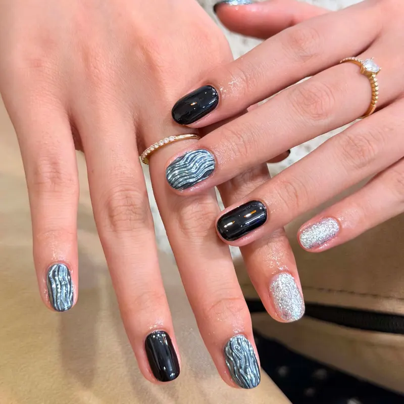 Navy and silver glitter nails with blue zebra art by LENA Nails & Beauty, nail salon in Da Nang