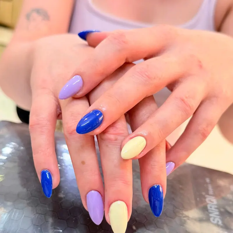 Blue, lilac and cream multicolour almond nails by LENA Nails & Beauty, nail salon in Da Nang