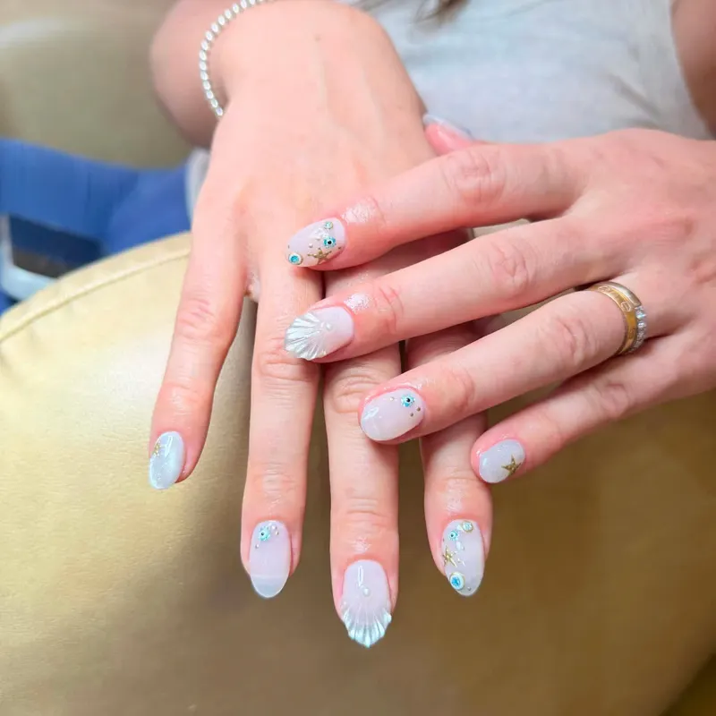 Pastel blue nails with fine line art by LENA Nails & Beauty, nail salon in Da Nang