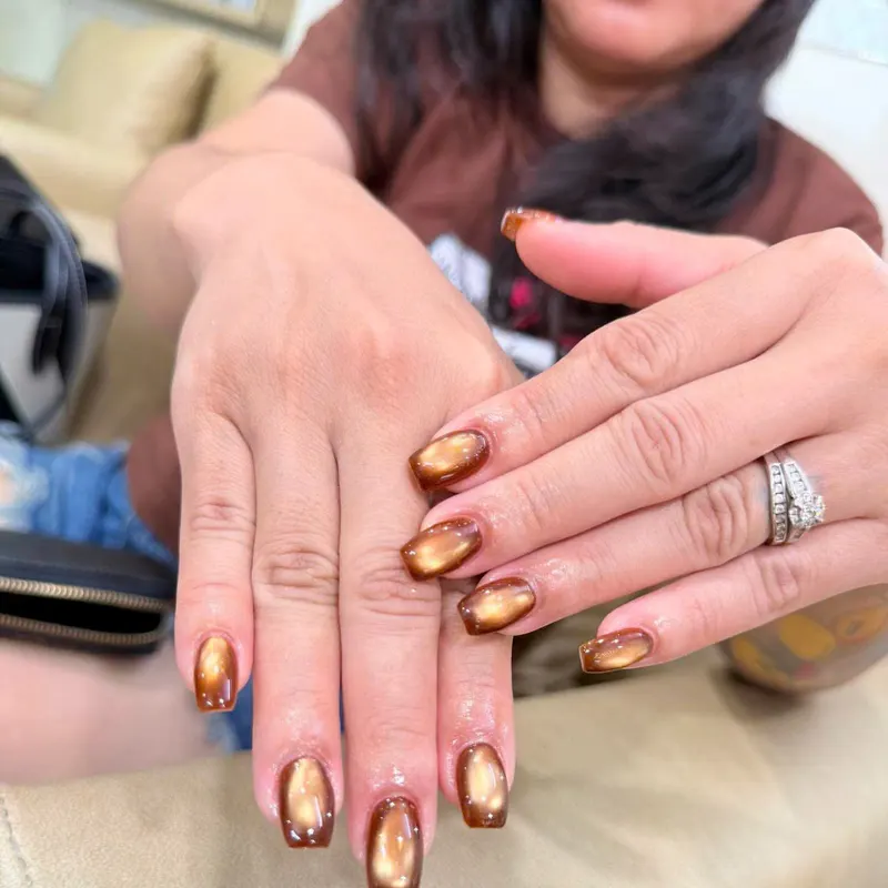 Gold and copper chrome nails by LENA Nails & Beauty, nail salon in Da Nang