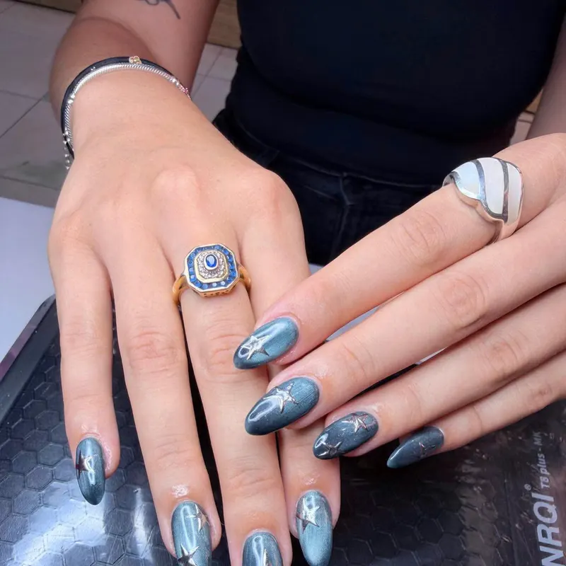 Dark teal chrome stiletto nails by LENA Nails & Beauty, nail salon in Da Nang