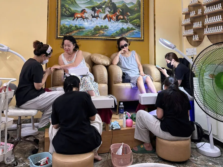 Guests having pedicures at LENA Nails & Beauty in Da Nang